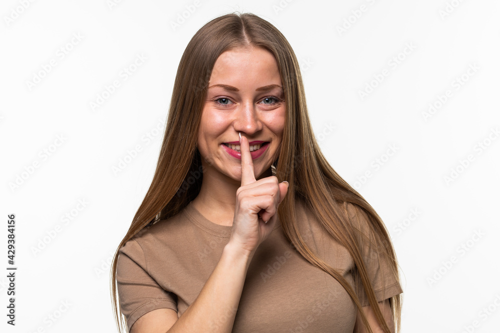 Portrait of beautiful woman with finger on lips isolated over white background Portrait of beautiful woman with finger on lips isolated over white background