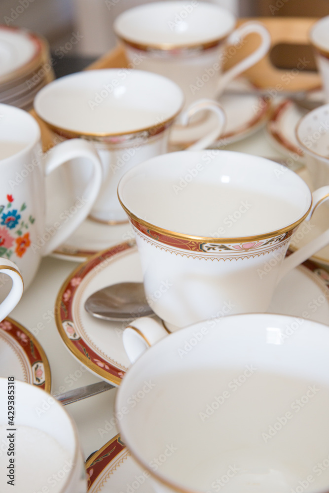 Stacks of empty bone chine teacups and saucers Stacks of empty bone chine teacups and saucers