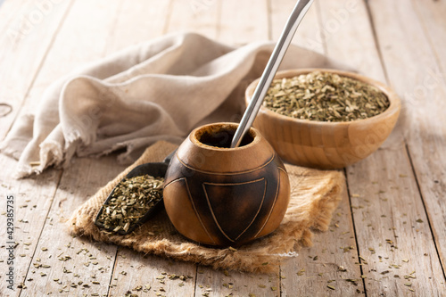 Traditional yerba mate tea on wooden table	