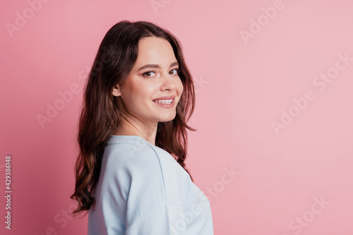 Lovely charming young girl posing look camera beaming white smile isolated on pink background