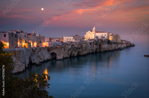 Scenic view of Vieste with the church of San Francesco at sunset, Gargano, Puglia, Italy photo