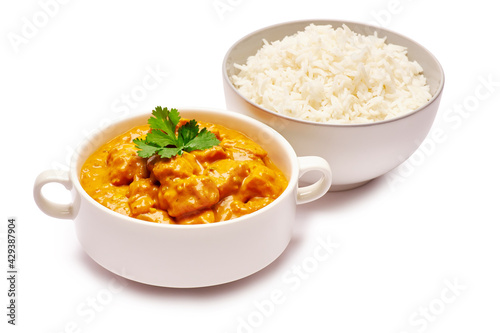 Traditional Chicken Curry and a bowl of boiled rice isolated on white background with clipping path embedded