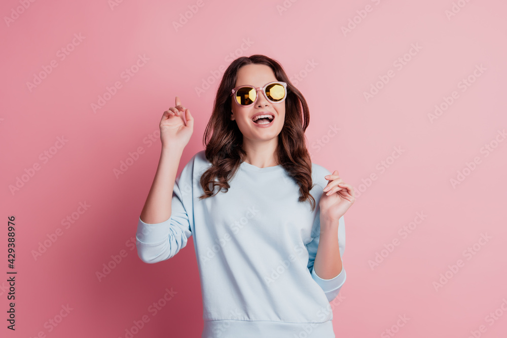 Funny gorgeous stylish lady wear sunglass have fun open mouth careless mood on pink wall Funny gorgeous stylish lady wear sunglass have fun open mouth careless mood on pink wall