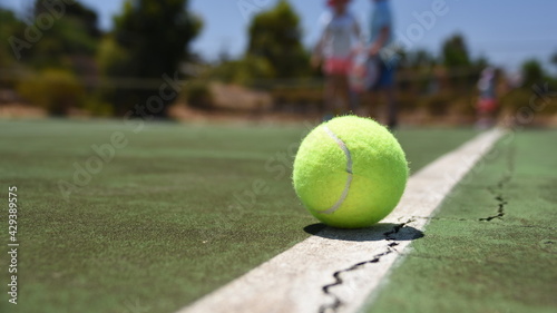 tennis ball on the court © Simon