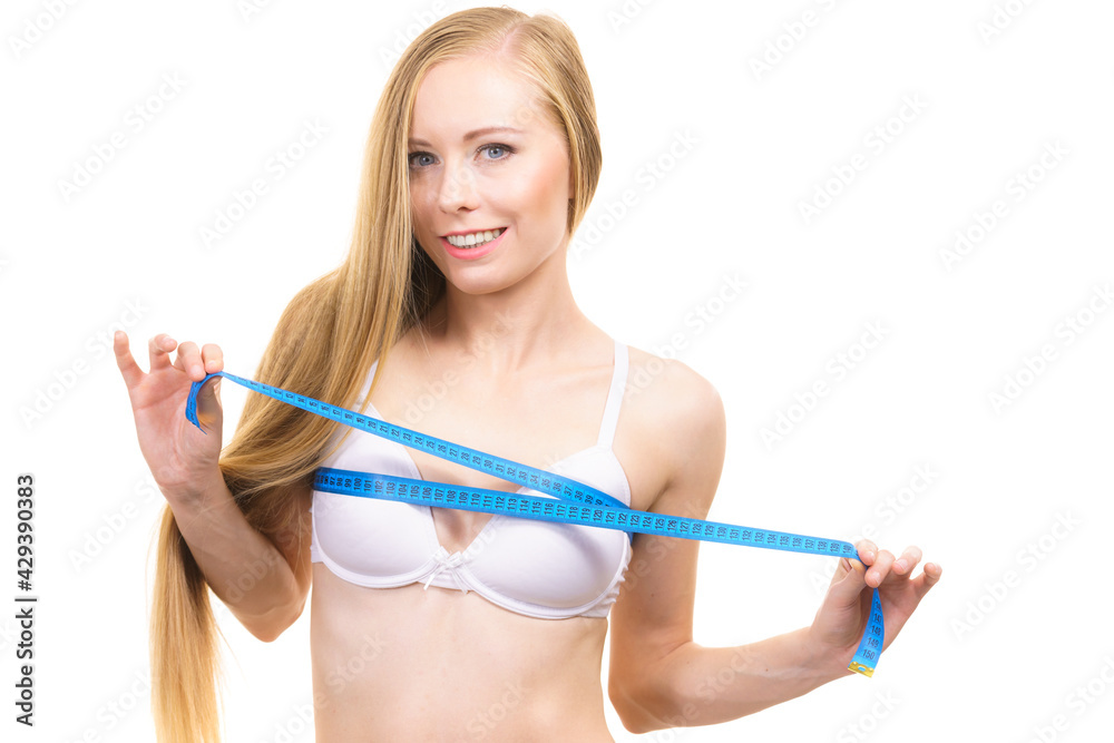 Girl measuring her chest breasts bust size Girl measuring her chest breasts bust size