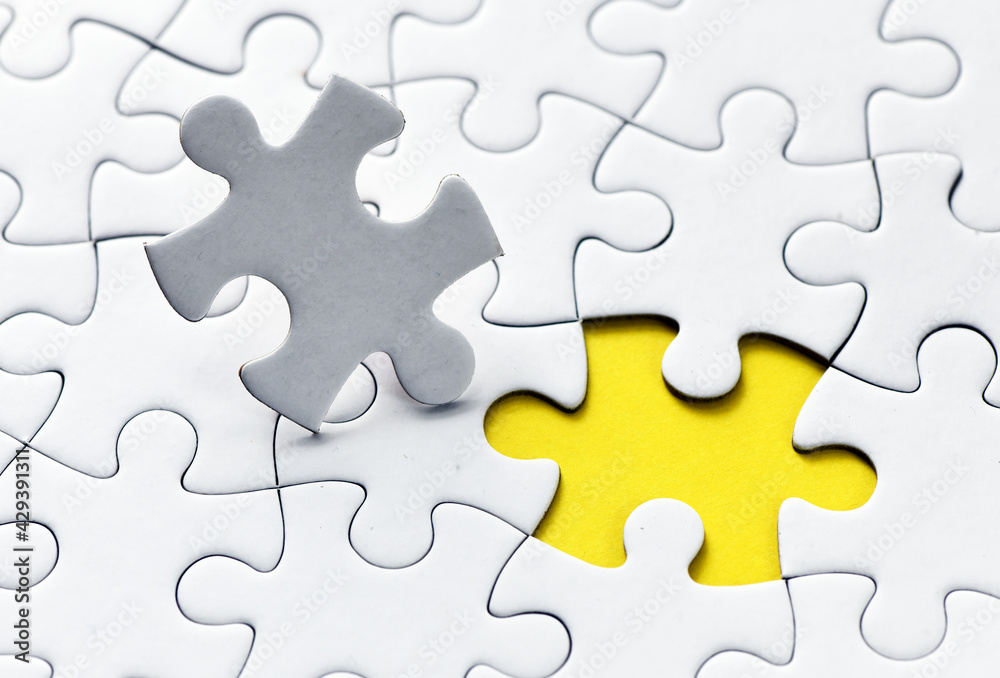 Assembling jigsaw puzzle pieces. Abstract background. Assembling jigsaw puzzle pieces. Abstract background.