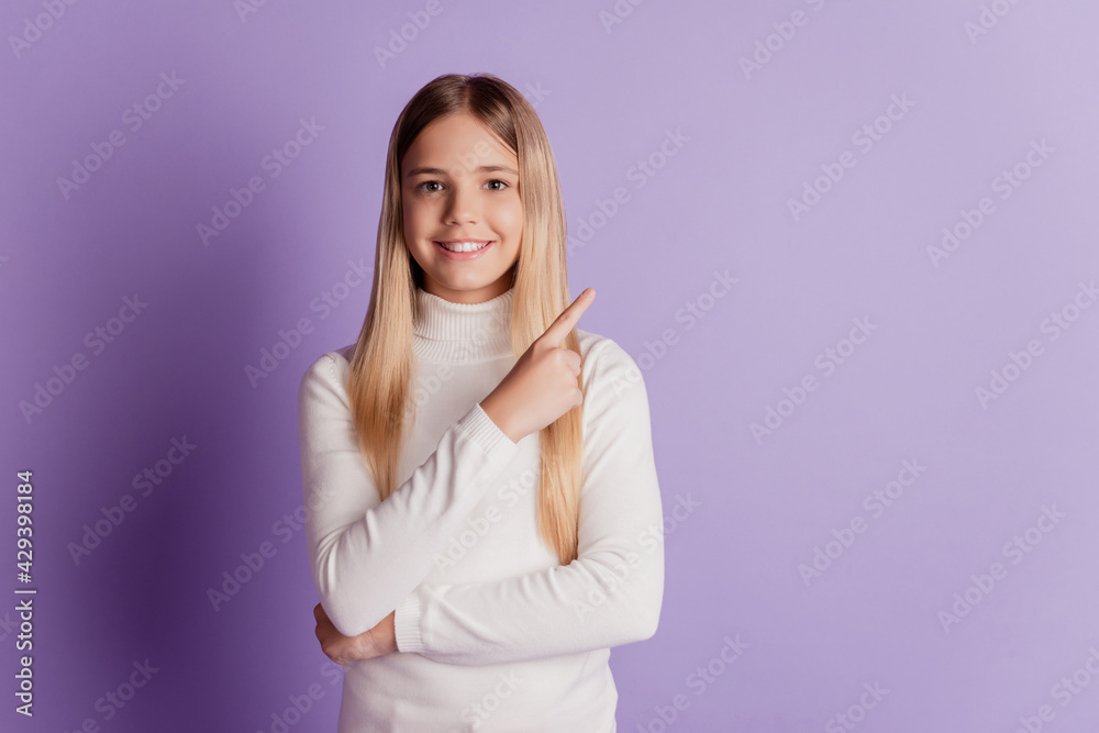 Photo of promoter small lady direct finger empty space wear white t-shirt posing on purple background Photo of promoter small lady direct finger empty space wear white t-shirt posing on purple background