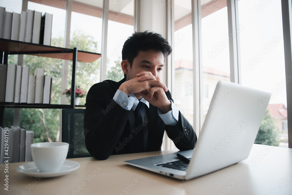 Smart asian businessman working with laptop at office. Smart asian businessman working with laptop at office.