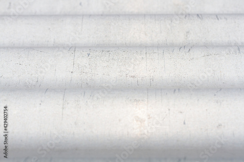 Defocused abstract metal background, wallpaper, empty template. Blurred grey metallic texture.