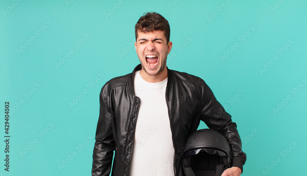 motorbike rider shouting aggressively, looking very angry, frustrated ...