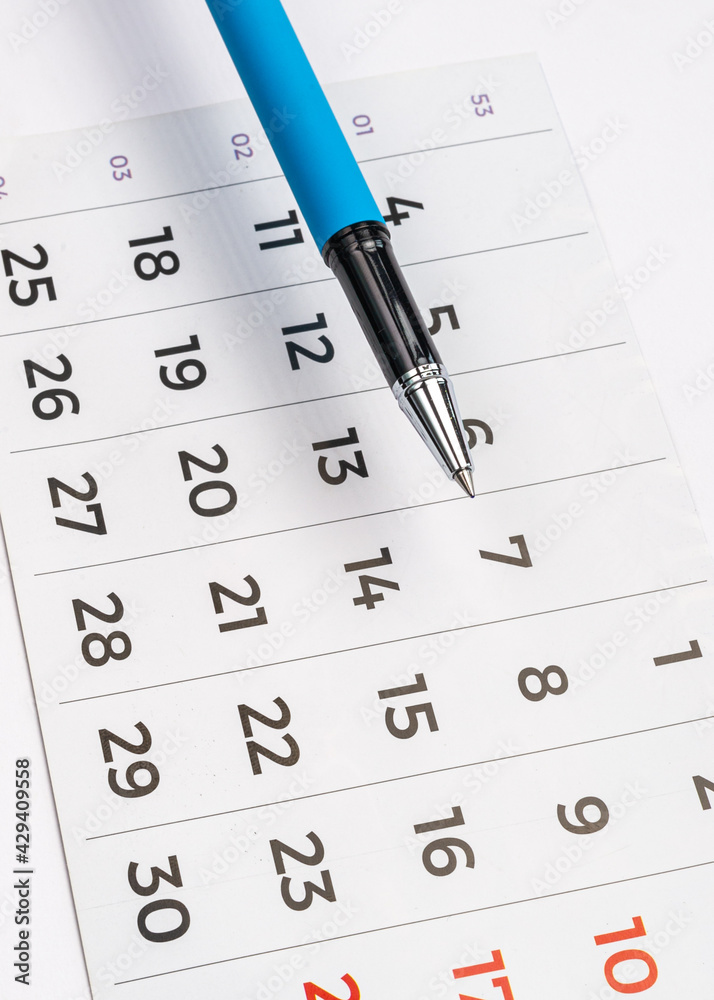 Blue pen and calendar week and days