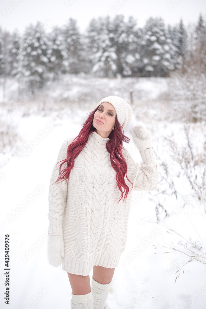 beautiful woman in the winter forest. young woman in a white sweater white hat with long laced hair on the background of a winter forest
beautiful woman in the winter forest. young woman in a white sweater white hat with long laced hair on the background of a winter forest