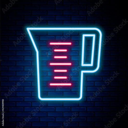 Glowing neon line Jug glass with water icon isolated on brick wall background. Kettle for water. Glass decanter with drinking water. Colorful outline concept. Vector