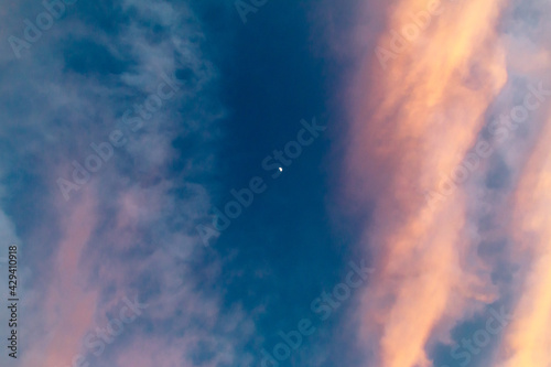 moon and color transitions between clouds