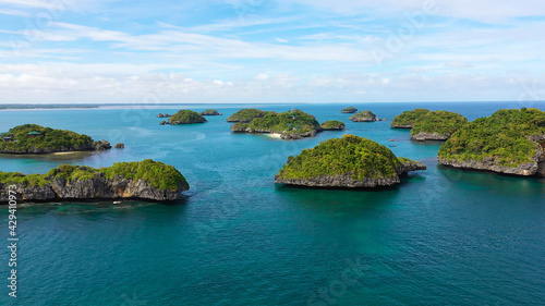 Cluster of small islands in Hundred Islands National Park, Pangasinan, Philippines. Aerial drone: Famous tourist attraction, Alaminos. Summer and travel vacation concept