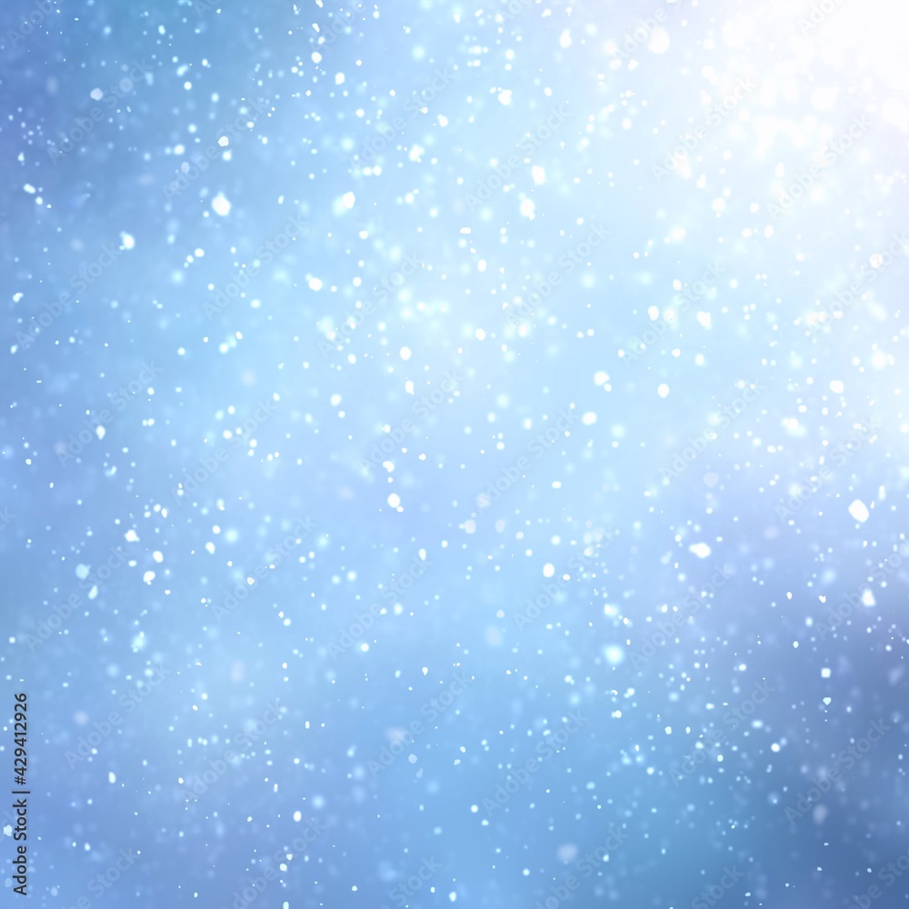 Snow  flakes fly in winter sky light abstract textured background. Blurred pattern. Blue color.