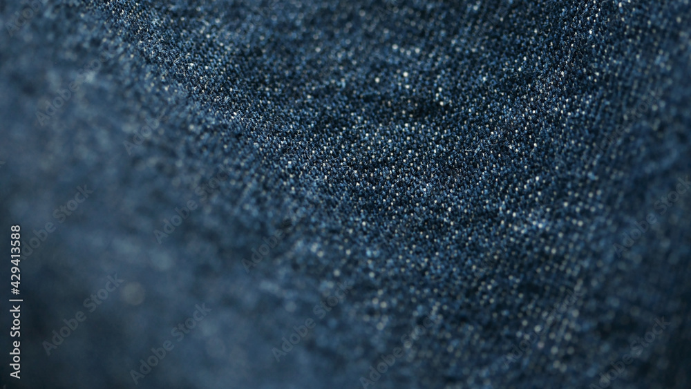 Jeans denim texture close up , focus only one point , soft blured background wallpaper