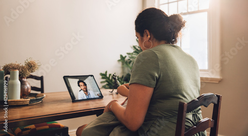 Woman having telemedicine appointment with doctor photo