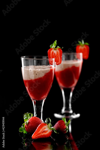 Strawberry and Strawberry Smoothie. Strawberry dessert. Black glossy background. Reflection. Place for your text.