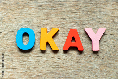 Wallpaper Mural Color alphabet letter in word okay on wood background Torontodigital.ca
