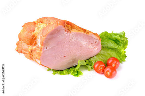 Smoked meat in a large piece on top with cherry tomatoes. Isolated on a white background.clipping path.
