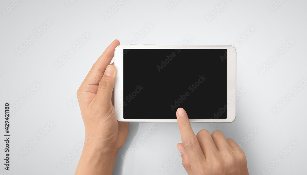 Hands holding tablet touch computer gadget Hands holding tablet touch computer gadget