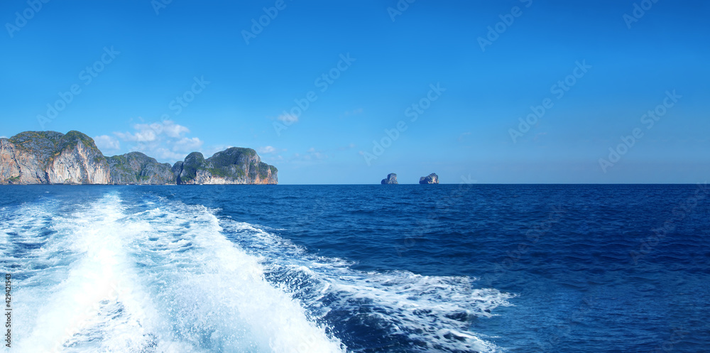 Sea wide panoramic view, seascape, islands. Horizon, open ocean, panorama, beautiful sky. Wake jet. Ship's wake. Trace of sea foam on a water behind a boat. Amazing Thailand