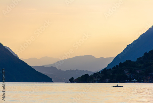 Tableau sur toile Sunset over lake Lugano between mountains during summer in Porleza, Italy
