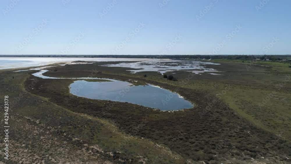 Low tide shore at the village of Boyardville eastern Oleron Island France with tide pools, Aerial flyover approach shot Low tide shore at the village of Boyardville eastern Oleron Island France with tide pools, Aerial flyover approach shot