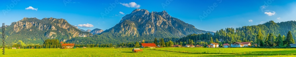 Schwangau village panorama in Bavaria, southern Germany with Neuschwanstein Castle and Tegelberg mountain peak 