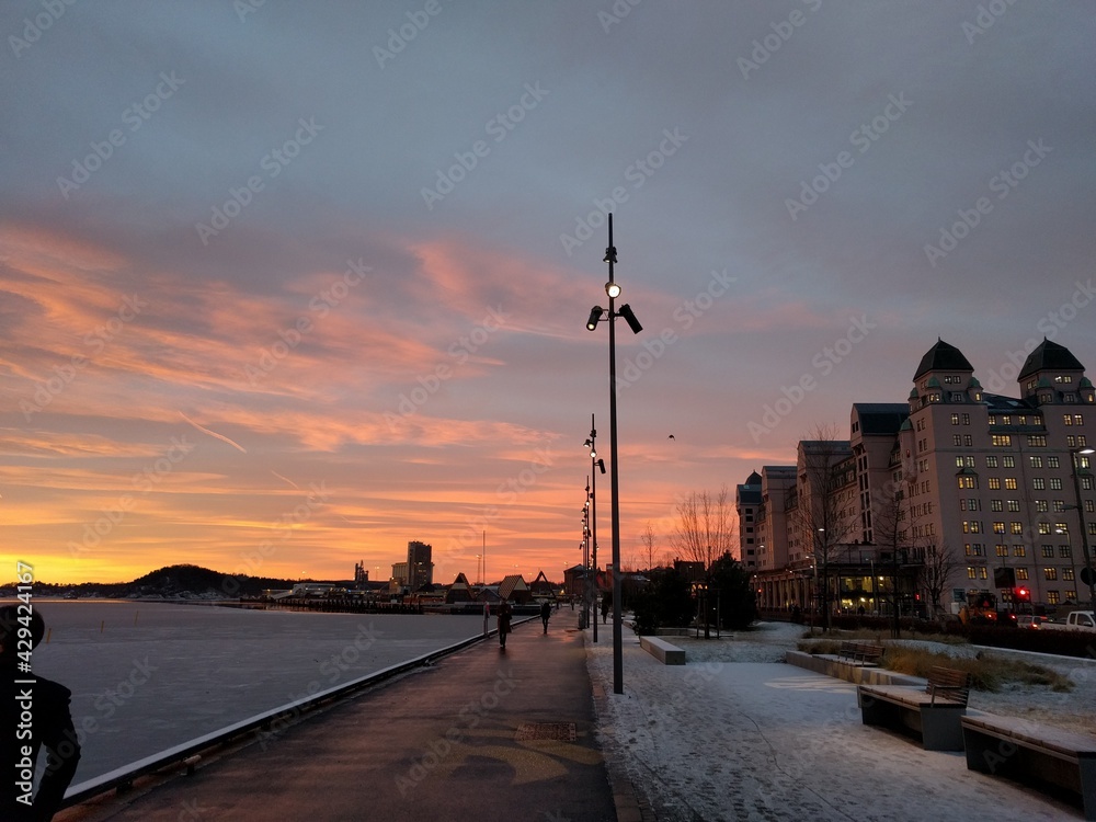 sunset by the docks in the city in the winter