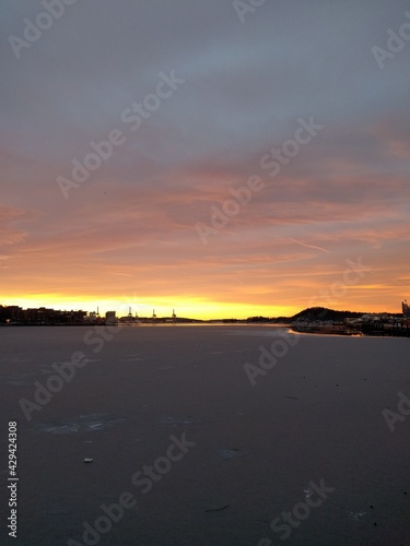 sunset by the docks in the city in the winter