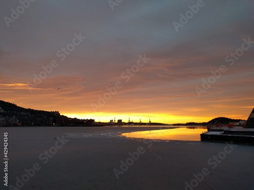 sunset by the docks in the city in the winter
