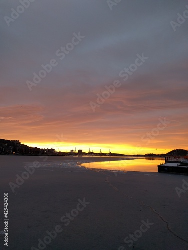 sunset by the docks in the city in the winter