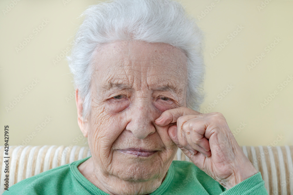 potrait of an old sad woman crying potrait of an old sad woman crying