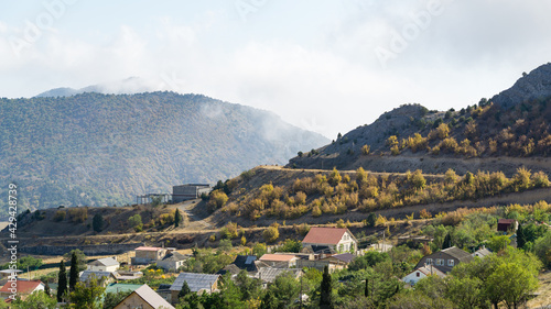 Veseloe village near Sudak. View of village Veseloe on the Black Sea coast on beautiful mountains background on sunny autumn day.