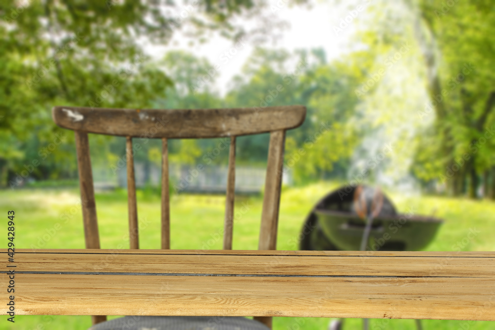 Wooden desk of free space and grill time in garden 