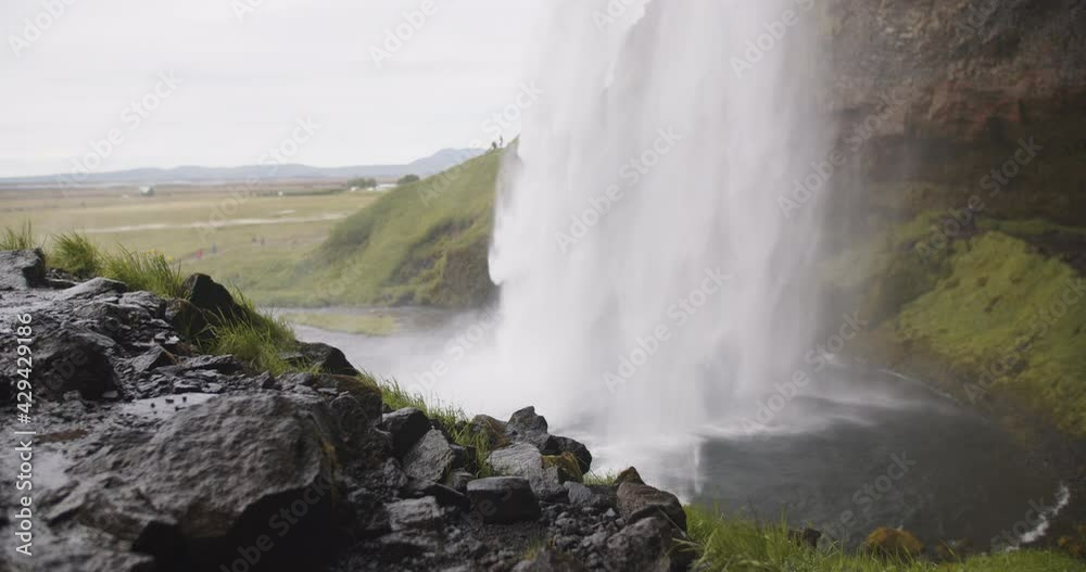 Seljalandsfoss waterfall in Iceland, side view slow motion Seljalandsfoss waterfall in Iceland, side view slow motion
