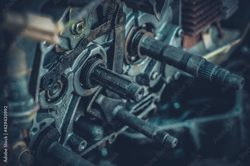 The motorcycle's engine is serviced or repaired by a mechanic. The motorcycle's engine is serviced or repaired by a mechanic.