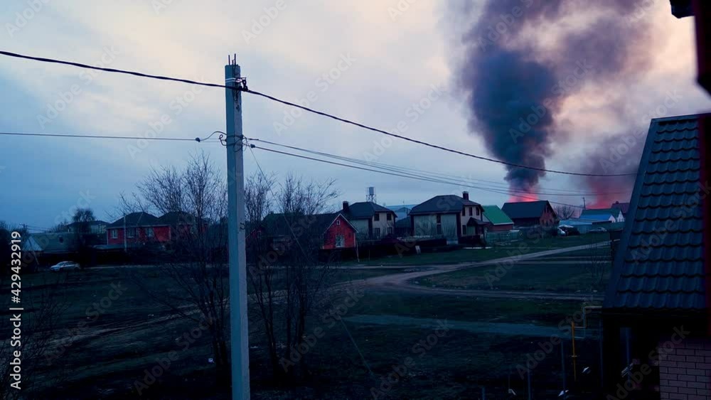 Residential suburban home engulfed by fire - orange flames with smoke. Extraordinary incident. Emergency call. rescue of people Residential suburban home engulfed by fire - orange flames with smoke. Extraordinary incident. Emergency call. rescue of people