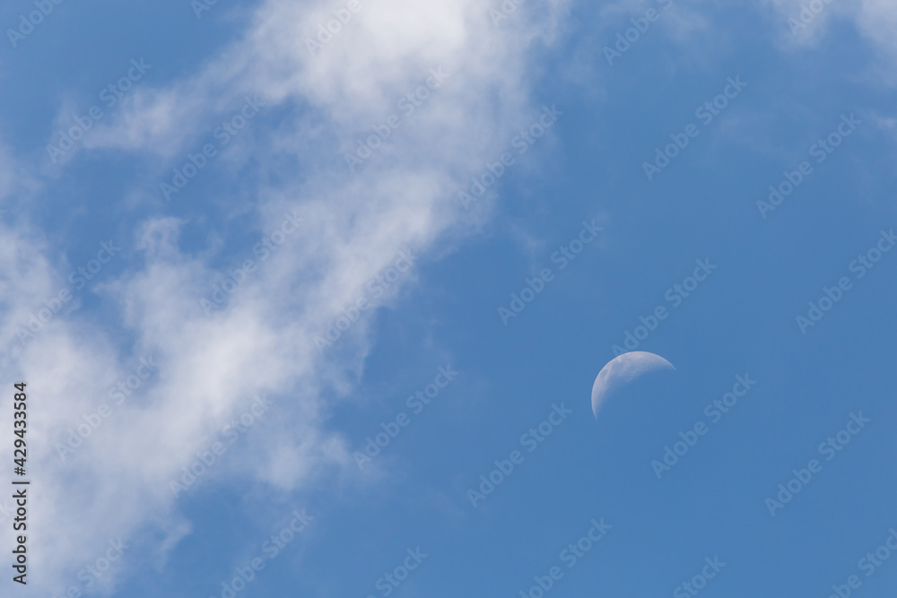 The white crescent moon in the afternoon cool white clouds on beautiful afternoon sky background Images for clear sky background design make you feel fresh and airy. The white crescent moon in the afternoon cool white clouds on beautiful afternoon sky background Images for clear sky background design make you feel fresh and airy.