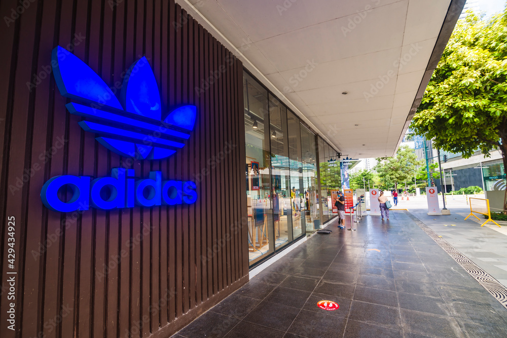 Bonifacio Global City, Taguig, Philippines - Aug 2020: An Adidas store at  Bonifacio High Street. A blue Adidas logo on the storefront. Viewed from  side. Stock Photo | Adobe Stock