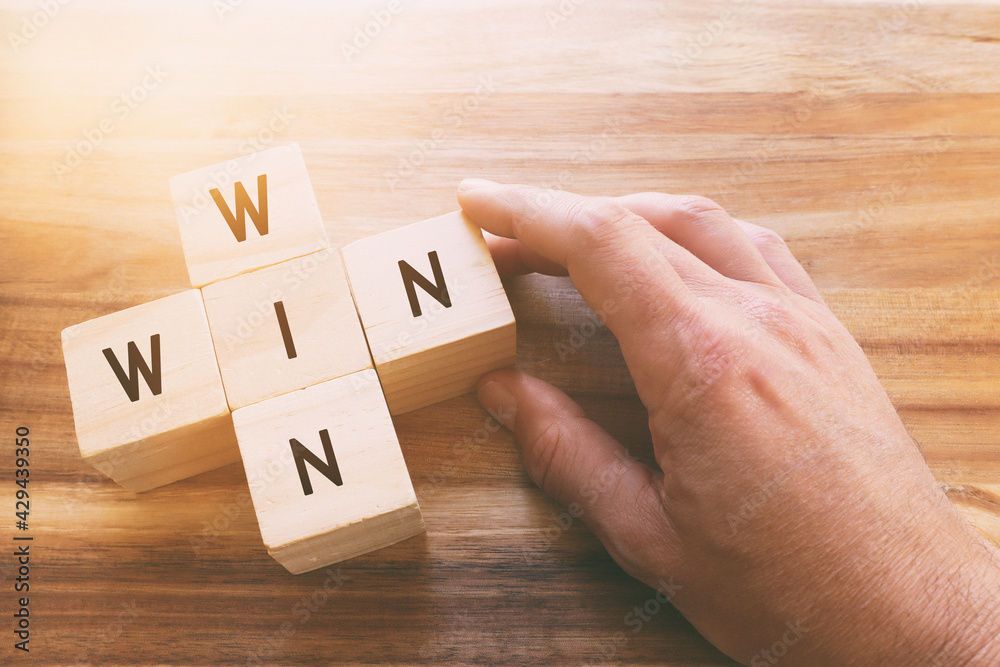 Wooden cubes stack with the text win-win-situation. Strategy and business concept