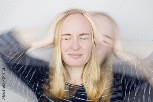 Woman loses consciousness and falls down due to dizziness and disturbance of the vestibular apparatus. Severe headache and migraine. Concept of helping people suffering from migraines and dizziness photo
