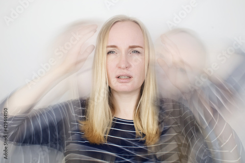 Woman loses consciousness and falls down due to dizziness and disturbance of the vestibular apparatus. Severe headache and migraine. Concept of helping people suffering from migraines and dizziness photo