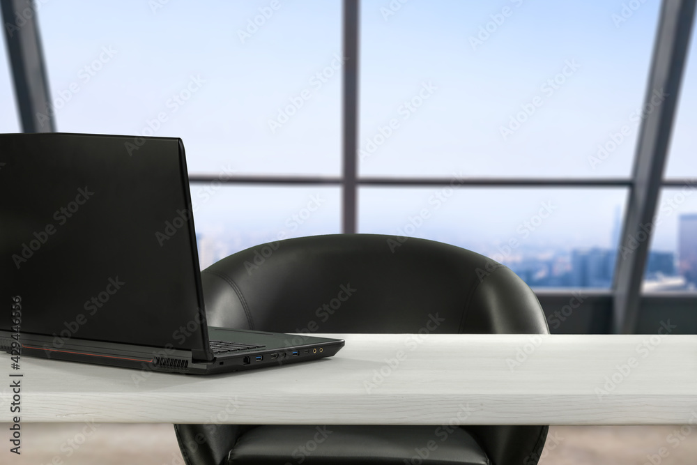 Table background of free space and laptop in office Table background of free space and laptop in office
