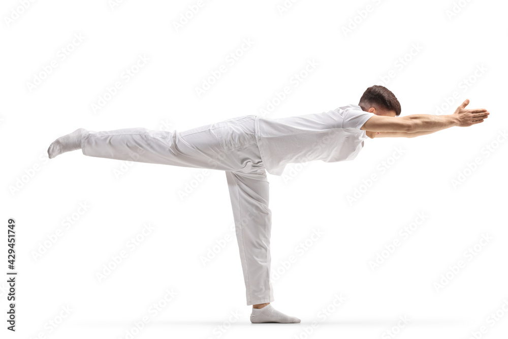 Man practicing a stretching yoga pose Man practicing a stretching yoga pose