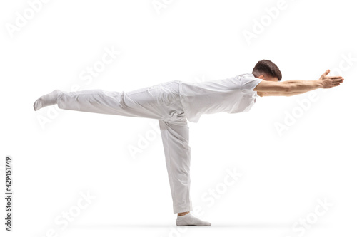 Man practicing a stretching yoga pose