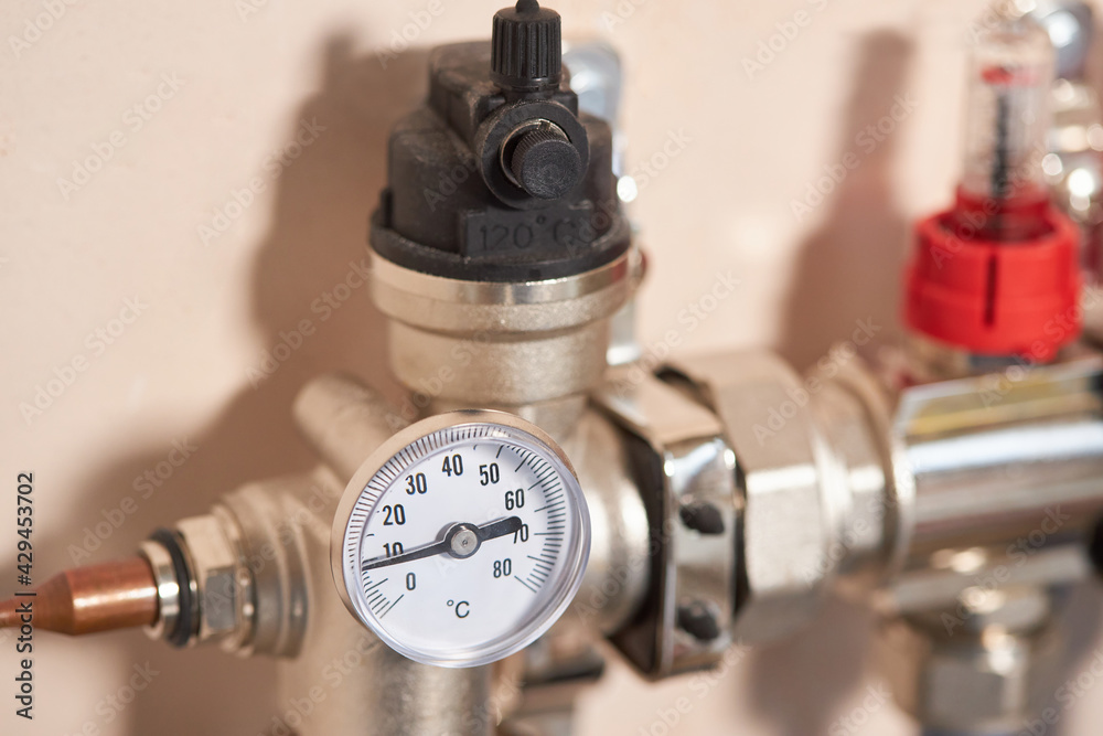 Pressure gauge that indicates pressure for underfloor heating and pipe breeding. Underfloor heating concept 