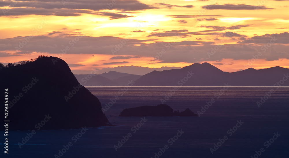 Cape Billano and Billano island at sunset. Basque country, Spain, Europe.